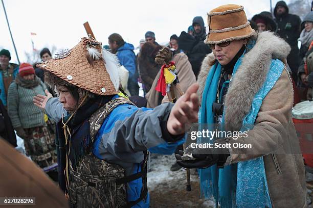 Virginia Redstar of the Colville tribe in Washington state is welcomed after traveling from the headwaters of the Missouri River in a dugout canoe to...