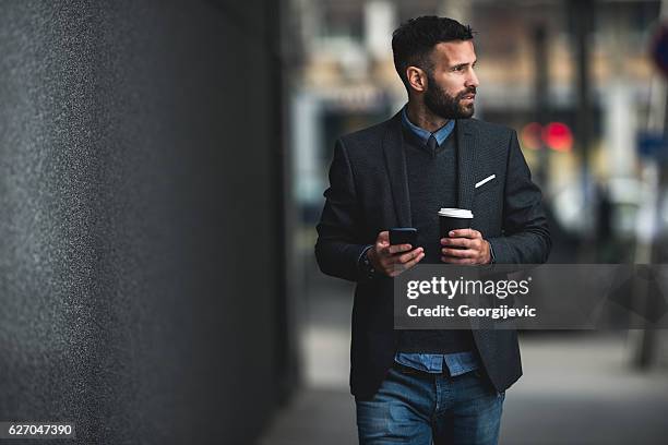 casual city walk - fashionable men stock pictures, royalty-free photos & images