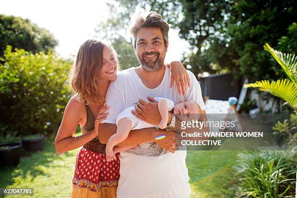 real bohemian family with newborn baby - two parents stock-fotos und bilder