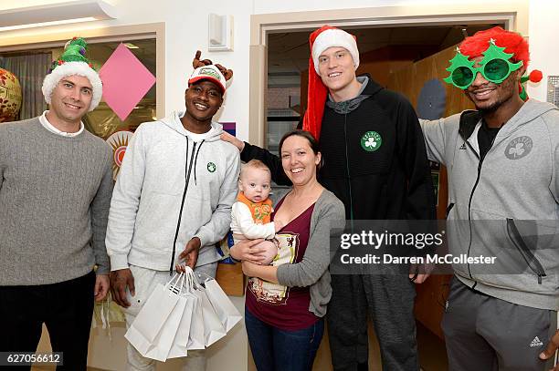 Boston Celtics Brad Stevens, Terry Rozier, Jonas Jerebko, and Marcus Smart take a picture with Fred and Mom at Boston Children's Hospital on December...