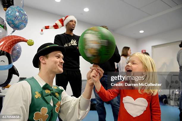 Boston Celtics mascot Lucky hangs with Grace at Boston Children's Hospital on December 1, 2016 in Boston, Massachusetts.