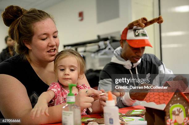 Boston Celtics Isaiah Thomas builds a ginger bread house with Isabella and Mom at Boston Children's Hospital on December 1, 2016 in Boston,...