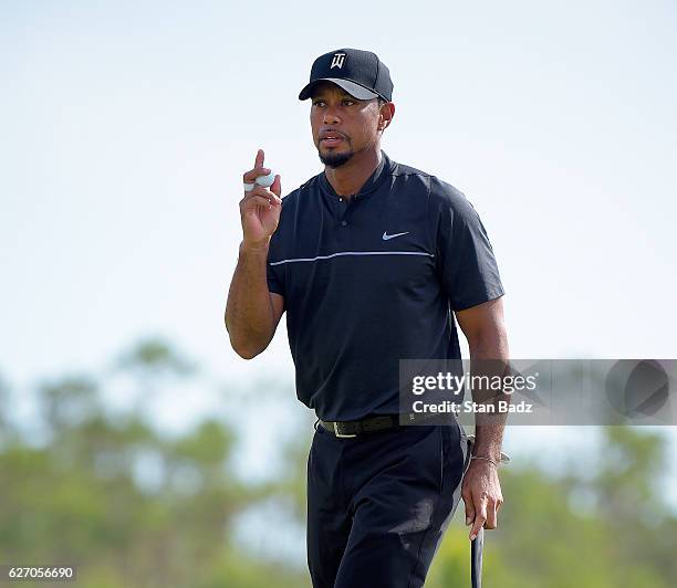 Tiger Woods acknowledges the gallery on the seventh hole during the first round of the Hero World Challenge at Albany course on December 1, 2016 in...