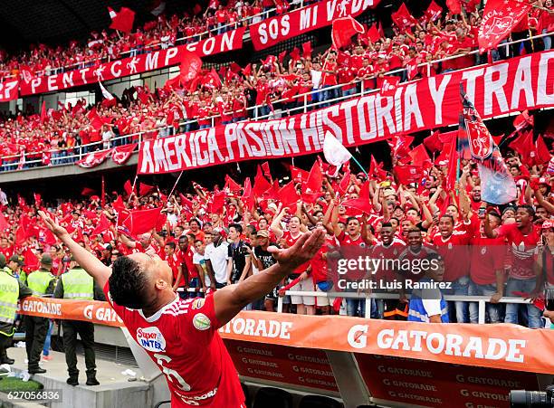 Players of America celebrate promotion to Liga Aguila after winning a match between America de Cali and Deportes Quindio as part of 6th round of...