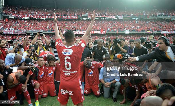 Players of America celebrate promotion to Liga Aguila after winning a match between America de Cali and Deportes Quindio as part of 6th round of...