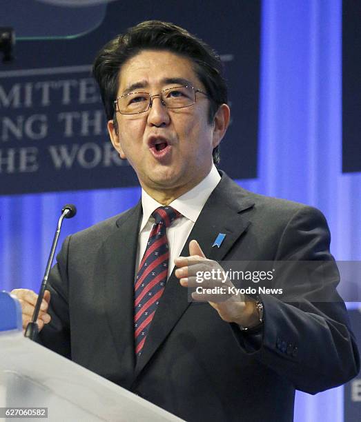 Switzerland - Japanese Prime Minister Shinzo Abe delivers a speech at the opening session of the World Economic Forum in the Swiss resort of Davos on...