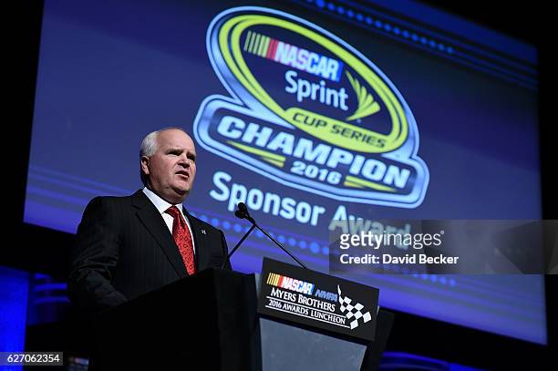 Robert Niblock, chief executive officer for Lowes, speaks after being presented the Champion Sponsor Award during the NASCAR NMPA Myers Brothers...