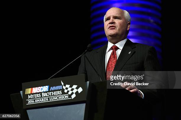 Robert Niblock, chief executive officer for Lowes, speaks after being presented the Champion Sponsor Award during the NASCAR NMPA Myers Brothers...