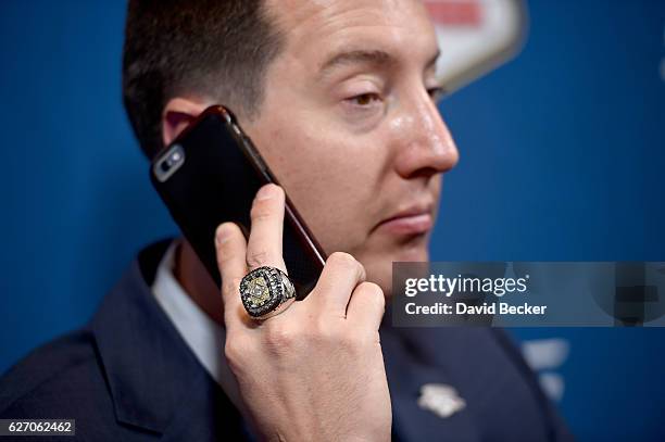 Kyle Busch talks on the phone during media availability after the NASCAR NMPA Myers Brothers Awards Luncheon at Wynn Las Vegas on December 1, 2016 in...