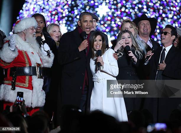 President Barack Obama sings Jingle Bells with Eva Longoria, Marc Anthony , James Taylor, Trisha Yearwood, Garth Brooks , Kelly Clarkson, Kim Taylor,...
