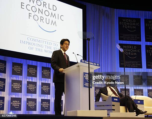 Switzerland - Japanese Prime Minister Shinzo Abe delivers a speech at the opening session of the World Economic Forum in the Swiss resort of Davos on...