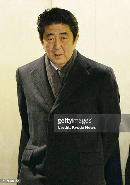 Japan - Japanese Prime Minister Shinzo Abe is pictured at Tokyo's Haneda airport on Jan. 23 after returning from Switzerland where he attended the...