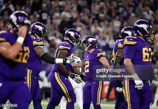 Kai Forbath of the Minnesota Vikings celebrates with teammates after kicking a field goal to go ahead 3-0 in the first quarter of the game against...