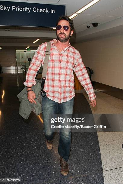 Gerard Butler is seen at LAX on December 01, 2016 in Los Angeles, California.