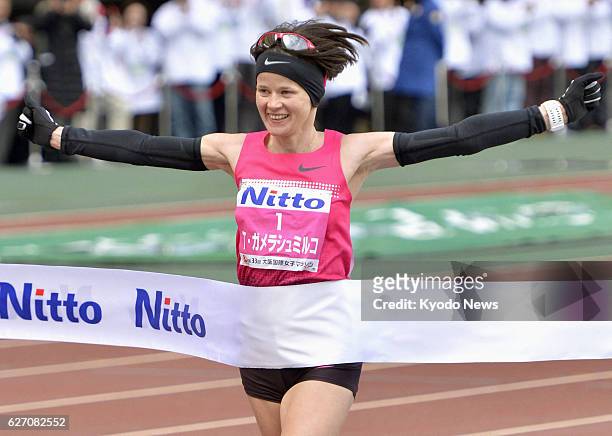 Japan - Tetiana Gamera-Shmyrko of Ukraine crosses the finish line at Nagai Stadium in Osaka on Jan. 26 winning the Osaka Women's Marathon for the...
