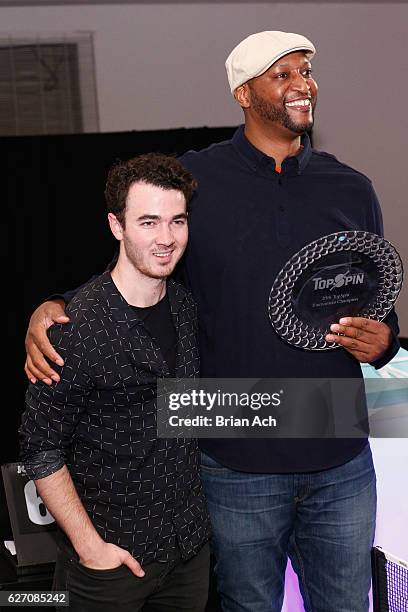 Former New York Knick, John Wallace participates in tournament with Kevin Jonas at the 8th Annual TopSpin New York Charity Event at Metropolitan...