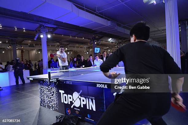 Preston Chin and Joel Roodyn play table tennis at the 8th Annual TopSpin New York Charity Event at Metropolitan Pavilion on December 1, 2016 in New...