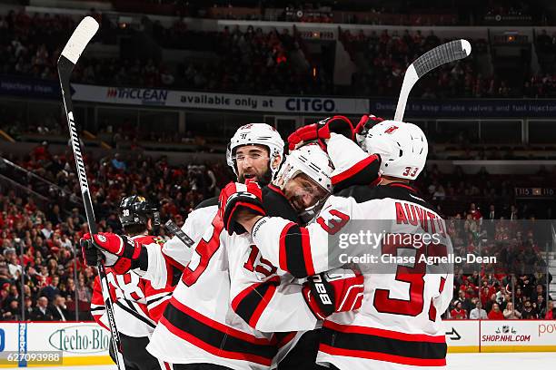 Travis Zajac of the New Jersey Devils celebrates after scoring his third goal against the Chicago Blackhawks in the third period at the United Center...