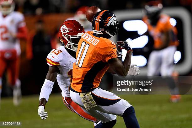 Denver Broncos wide receiver Jordan Norwood muffs a punt as Kansas City Chiefs wide receiver De'Anthony Thomas closes in on him during the fourth...