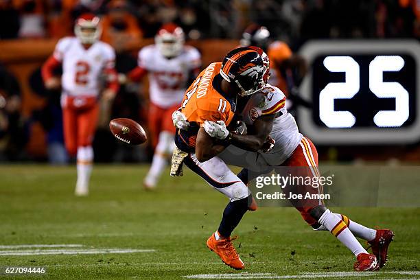 Denver Broncos wide receiver Jordan Norwood muffs a punt as Kansas City Chiefs wide receiver De'Anthony Thomas lights him up during the fourth...