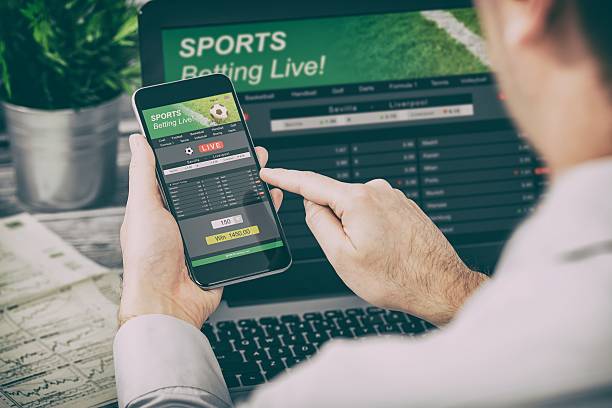 betting bet sport phone gamble laptop concept - sports gambling addiction stock pictures, royalty-free photos & images