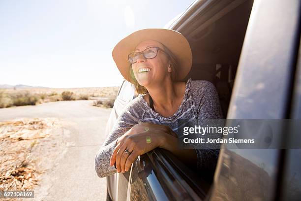 a female on a roadtrip. - nevada stockfoto's en -beelden