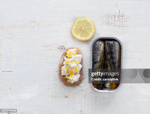 goat cheese canapé with sardines - carolafink stock pictures, royalty-free photos & images