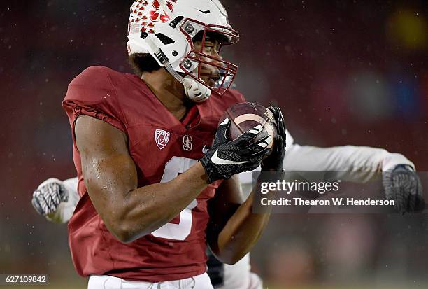 Francis Owusu of the Stanford Cardinal catches a fourty six yard touchdown pass against the Rice Owls in the third quarter of their NCAA football...