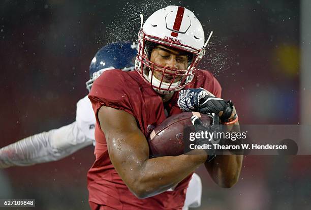 Francis Owusu of the Stanford Cardinal catches a fourty six yard touchdown pass against the Rice Owls in the third quarter of their NCAA football...