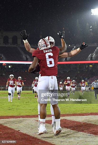 Francis Owusu and Dalton Schultz of the Stanford Cardinal celebrates after Owusu catches a fourty six yard touchdown pass against the Rice Owls in...