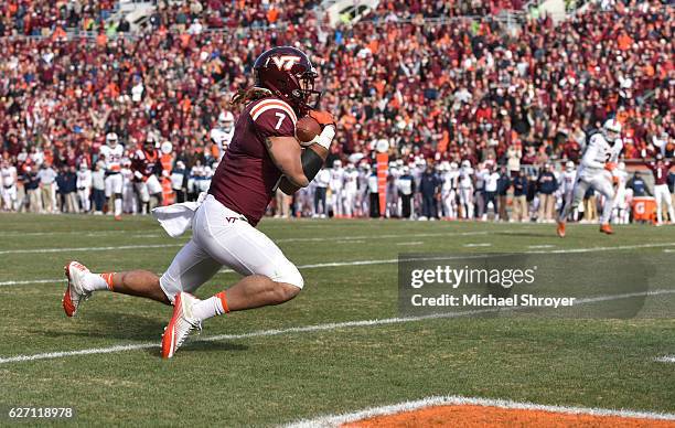 Tight end Bucky Hodges of the Virginia Tech Hokies catches a touchdown pass against the Virginia Cavaliers in the second half at Lane Stadium on...