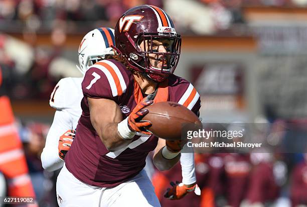 Tight end Bucky Hodges of the Virginia Tech Hokies has a reception go through his hands in the first half against the Virginia Cavaliers at Lane...