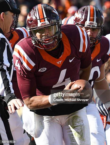 Quarterback Jerod Evans of the Virginia Tech Hokies reacts after his touchdown run against the Virginia Cavaliers in the first half at Lane Stadium...