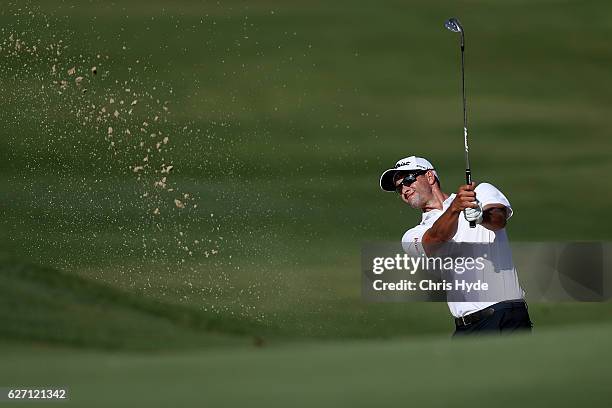 Adam Scott of Australia plays out of the bunker during day two of the 2016 Australian PGA Championship at RACV Royal Pines Resort on December 2, 2016...