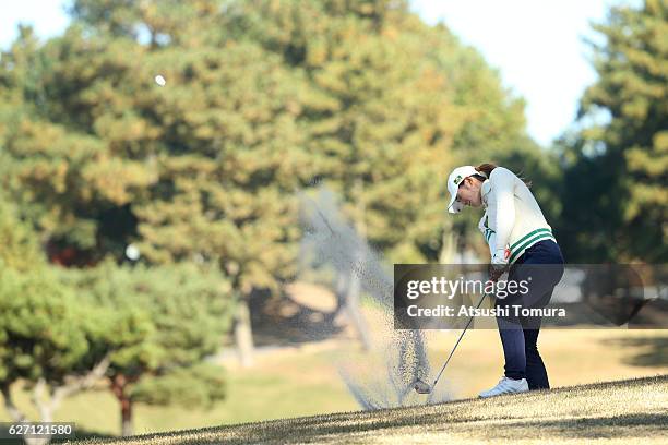 Ayaka Watanabe of Japan hits from a bunker on the 15th hole during the first round of the THE QUEENS Presented By KOWA at the Miyoshi Country Club...