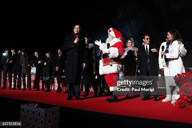 President Barack Obama onstage with talent during the finale of the 94th Annual National Christmas Tree Lighting Ceremony on the Ellipse in...