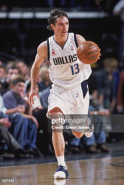 Point guard Steve Nash of the Dallas Mavericks dribbles the ball during the NBA game against the Phoenix Suns at American Airlines Center in Dallas,...