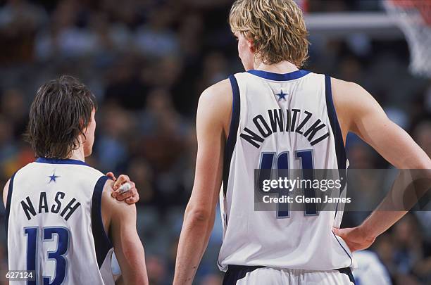 Point guard Steve Nash of the Dallas Mavericks talks to forward Dirk Nowitzki during the NBA game against the Phoenix Suns at American Airlines...