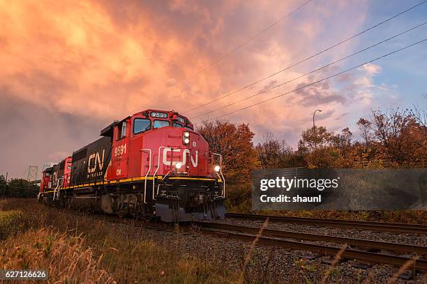 cn freight train - railway tracks sunset stock pictures, royalty-free photos & images