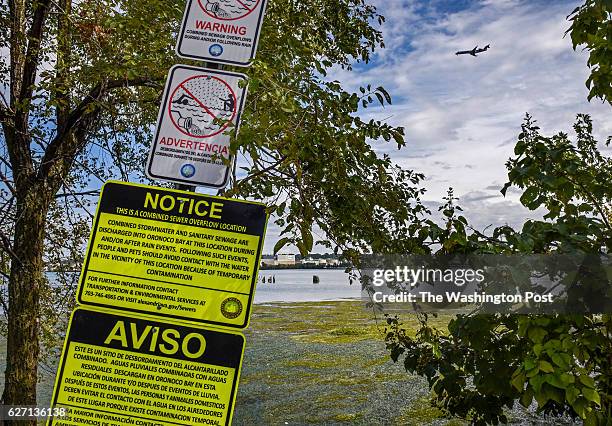 Signage acts as a warning about city sewage where it enters the Potomac river at the Oronoco outfall on September 2016 in Alexandria, VA.