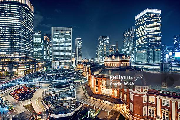 tokyo, japan cityscape at tokyo station - office building entrance night stock pictures, royalty-free photos & images