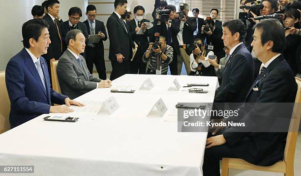 Japanese Prime Minister Shinzo Abe speaks at a meeting in Tokyo on Dec. 2, 2016 with Cabinet ministers on the issue of North Korea's abductions of...