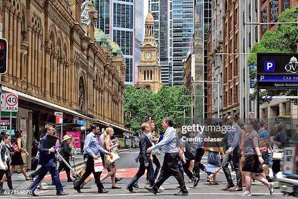 people crowd crossing street in central sydney - australia taxi stock pictures, royalty-free photos & images