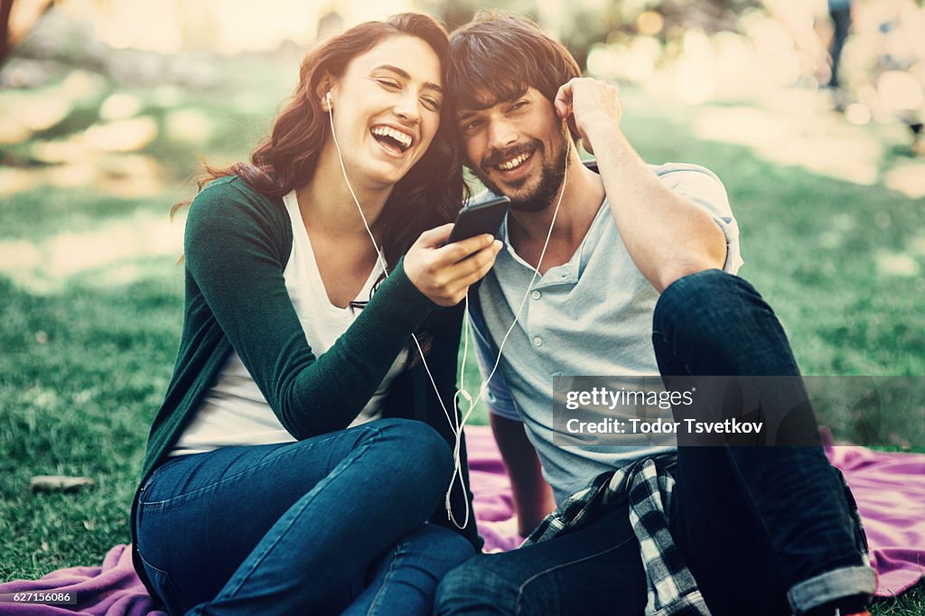 Happy couple listening to music