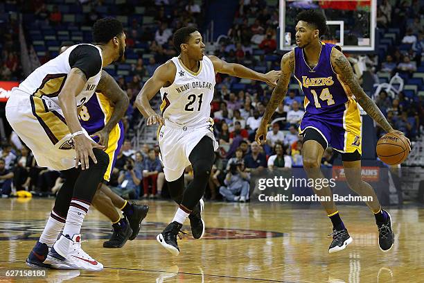 Brandon Ingram of the Los Angeles Lakers drives against Anthony Brown of the New Orleans Pelicans during the second half of a game at the Smoothie...