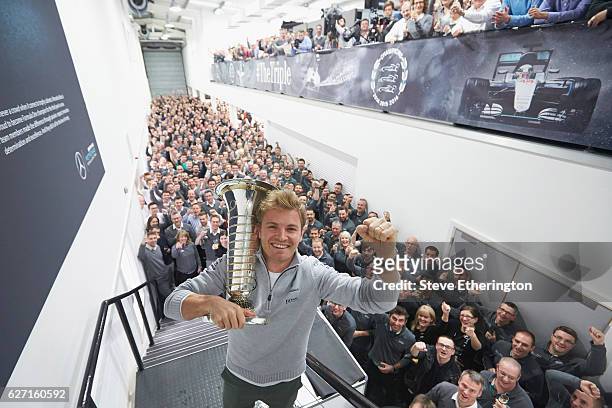 Nico Rosberg of Germany and Mercedes GP celebrates winning the F1 World Drivers Championship with Mercedes GP staff on December 1, 2016 in Brackley,...