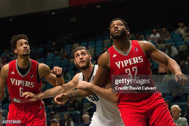 Georgios Papagiannis of the Reno Bighorns tries to box out Joshua Smith and JP Tokoto of the Rio Grande Valley Vipers at the Reno Events Center on...