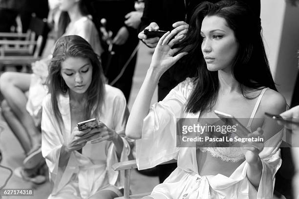 This Image has been converted to Black and White. Gigi Hadid and Bella Hadid pose backstage prior to the Victoria's Secret Fashion Show on November...