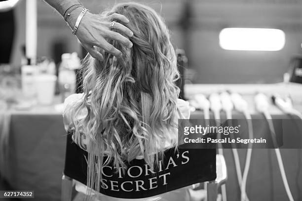 This Image has been converted to Black and White. A Model prepares backstage prior to the Victoria's Secret Fashion Show on November 30, 2016 in...