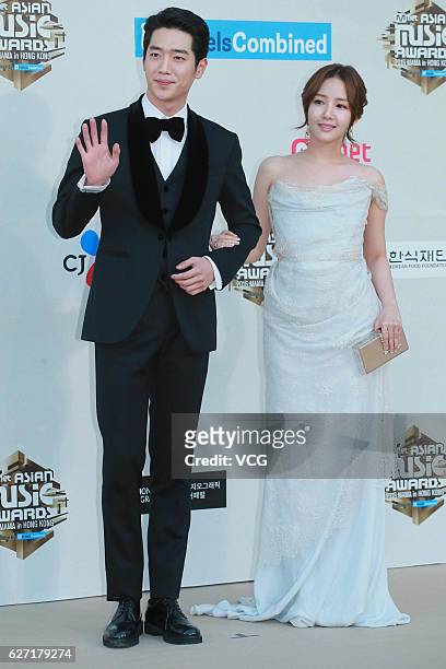 Actor Seo Kang-joon and actress Park Min-young arrive at the red carpet during the 2016 Mnet Asian Music Awards at AsiaWorld-Expo on December 2, 2016...